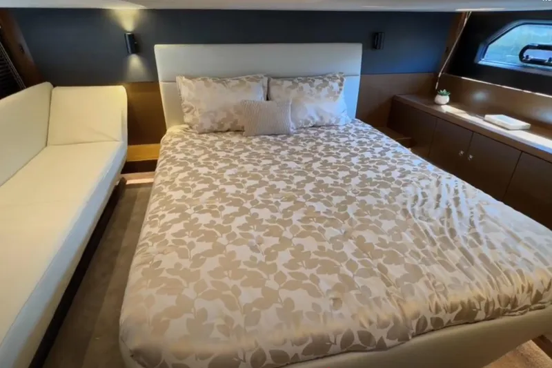 Slide: The Image of Luxurious bedroom interior of 2023 Bavaria R40 Coupe yacht with elegant bedding and modern design. - 31