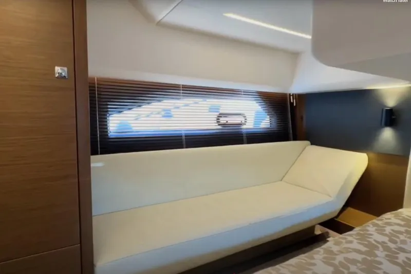 Slide: The Image of 2023 Bavaria R40 Coupe interior with modern sofa and window blinds. - 32