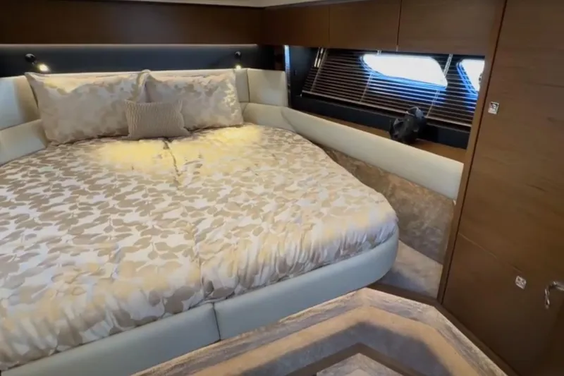 Slide: The Image of Luxurious bedroom interior of 2023 Bavaria R40 Coupe yacht with elegant bedding and wood accents. - 33