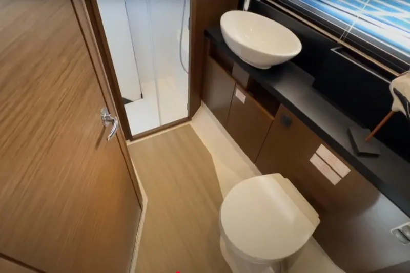 Slide: The Image of 2023 Bavaria R40 Coupe bathroom with modern fixtures and wooden accents. - 35