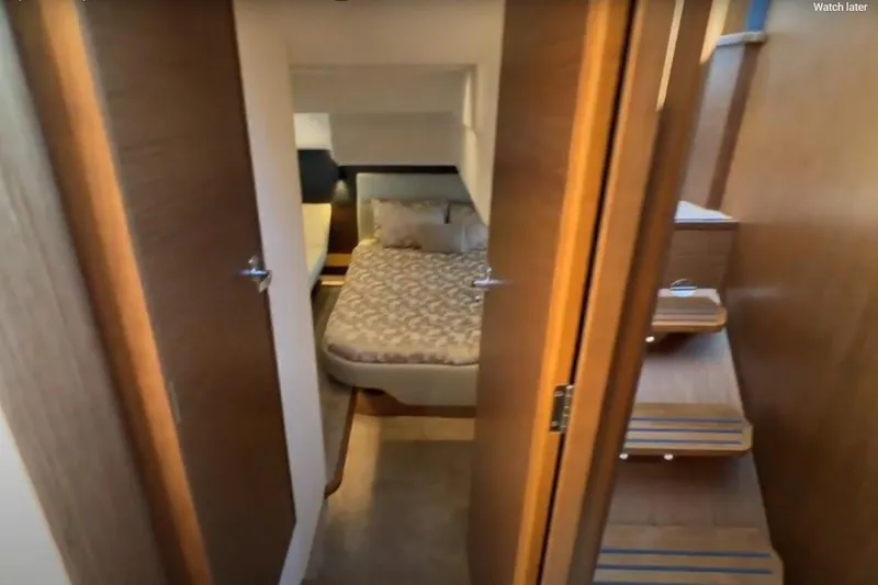 Slide: The Image of Interior of 2023 Bavaria R40 Coupe, featuring a cozy bedroom and wooden stairs. - 37