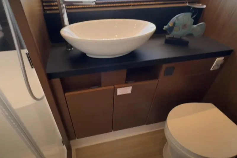 Slide: The Image of Luxurious bathroom in 2023 Bavaria R40 Coupe yacht with modern sink and decor. - 39