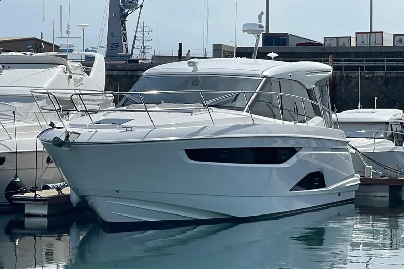 Slide: The Image of 2023 Bavaria R40 Coupe yacht docked in marina, sleek design, modern luxury vessel. - 5