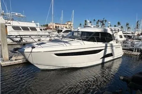Slide: The Image of 2023 Bavaria R40 Coupe yacht docked at a marina under clear blue skies. - 7