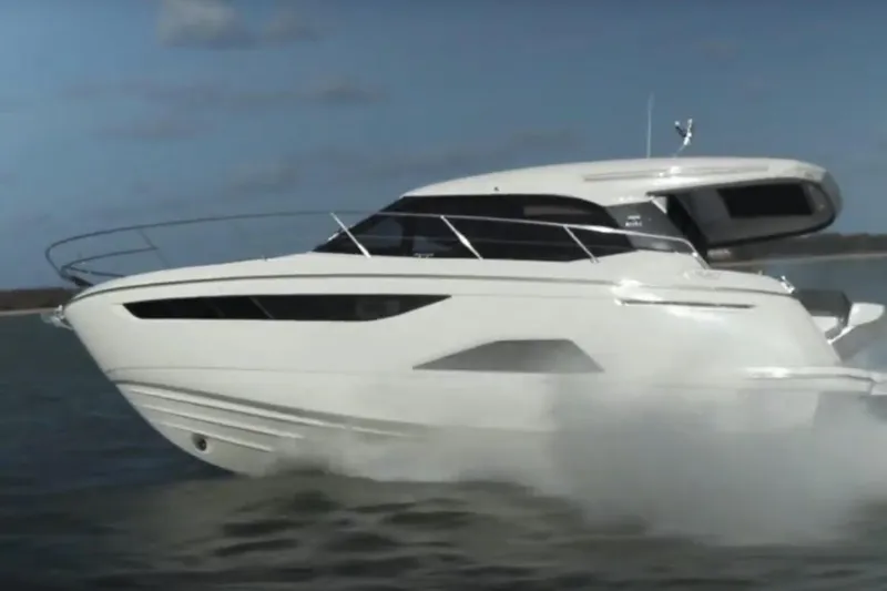 Slide: The Image of 2023 Bavaria R40 Coupe cruising on open water, showcasing sleek design and performance. - 8