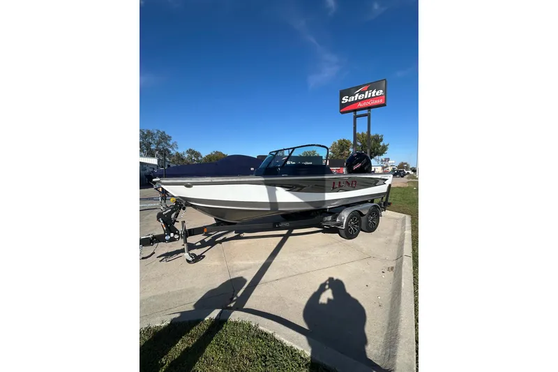 Slide: The Image of 2026 Lund 1875 Impact XS Sport boat on trailer at Premier Boating Center. - 11