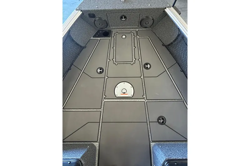 Slide: The Image of 2026 Lund 1875 Impact XS Sport boat on trailer, parked outdoors under clear sky. - 22