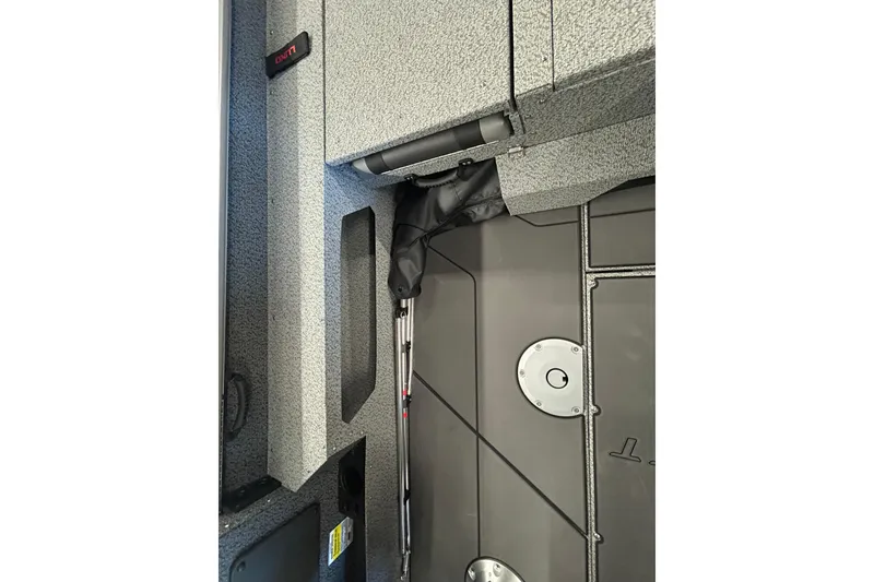 Slide: The Image of 2026 Lund 1875 Impact XS Sport boat on trailer under clear blue sky. - 23