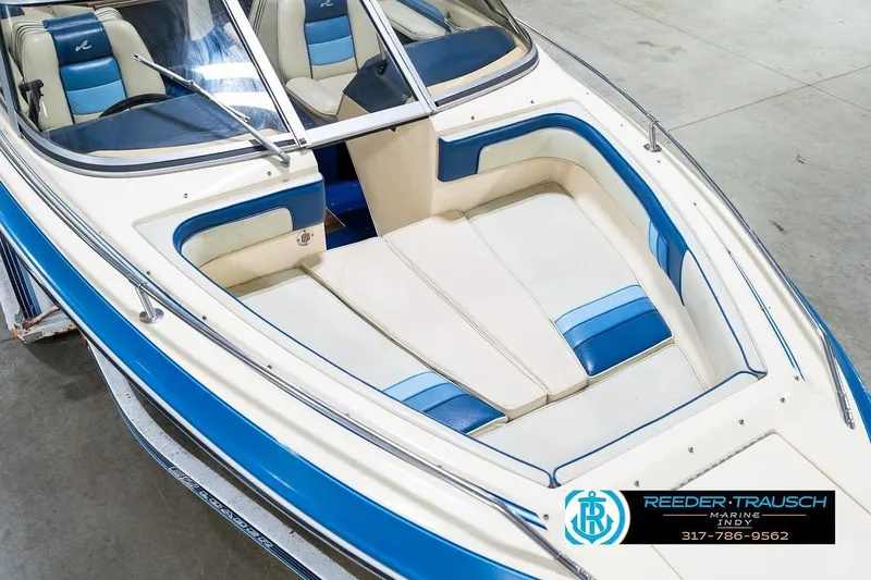 Slide: The Image of 1987 Sea Ray Sorrento 21 boat with blue and white interior, showcased by Reeder-Trausch Marine. - 12