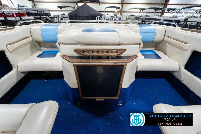 Slide: The Image of Interior of 1987 Sea Ray Sorrento 21 boat with blue and white seating. - 20