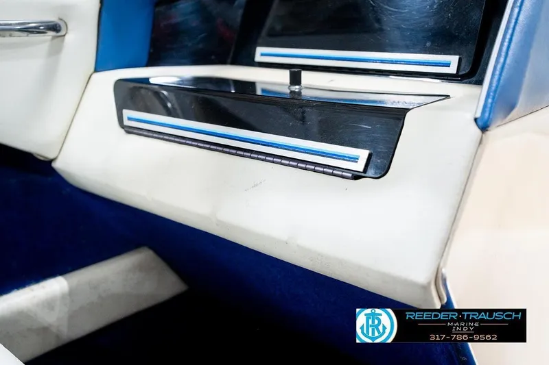 Slide: The Image of 1987 Sea Ray Sorrento 21 dashboard detail with blue and white accents. - 24