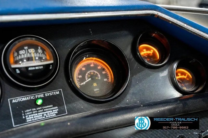 Slide: The Image of Dashboard of a 1987 Sea Ray Sorrento 21 boat with illuminated gauges. - 35