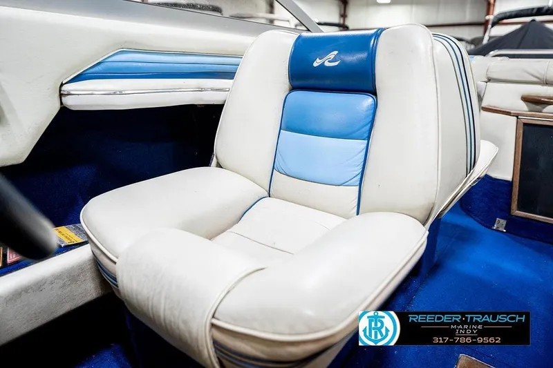 Slide: The Image of 1987 Sea Ray Sorrento 21 boat interior with blue and white seating. - 37