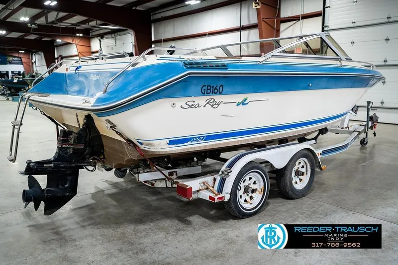 Slide: The Image of 1987 Sea Ray Sorrento 21 boat on trailer in indoor showroom. - 7
