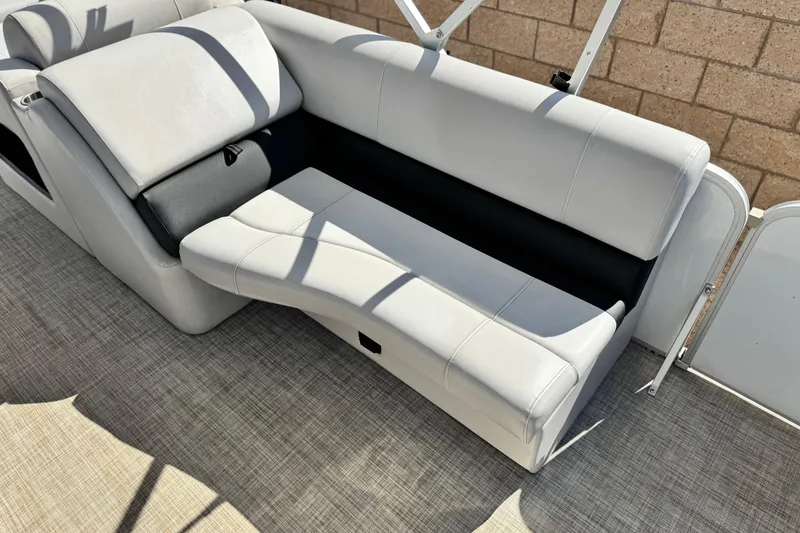 Slide: The Image of 2020 SunCatcher V24 SS boat interior with comfortable white seating and modern design. - 14