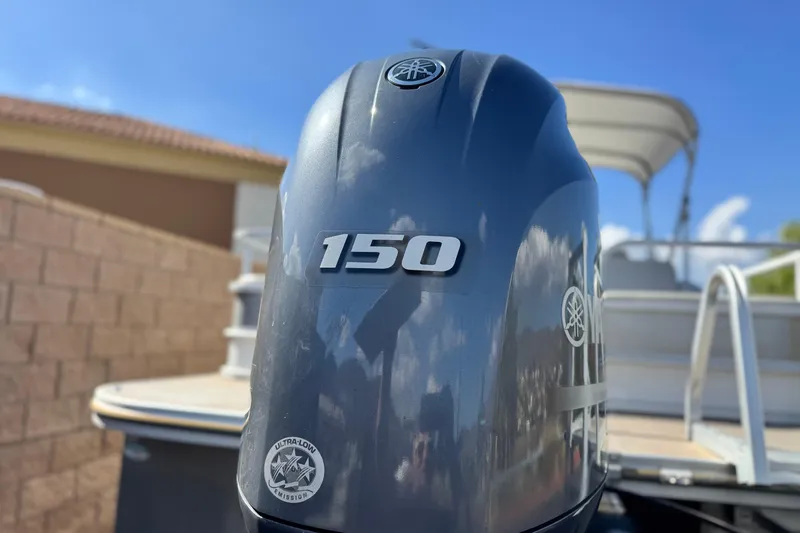 Slide: The Image of Outboard motor on 2020 SunCatcher V24 SS pontoon boat, featuring 150 horsepower. - 8