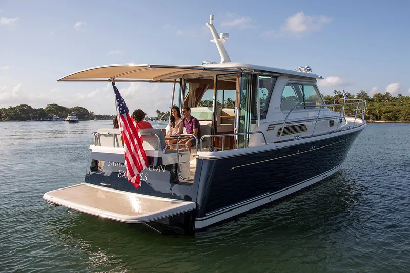 Slide: The Image of Manufacturer Provided Image: Luxurious interior of 2026 Sabre 38 Salon Express yacht with elegant seating and wooden finishes. - 3