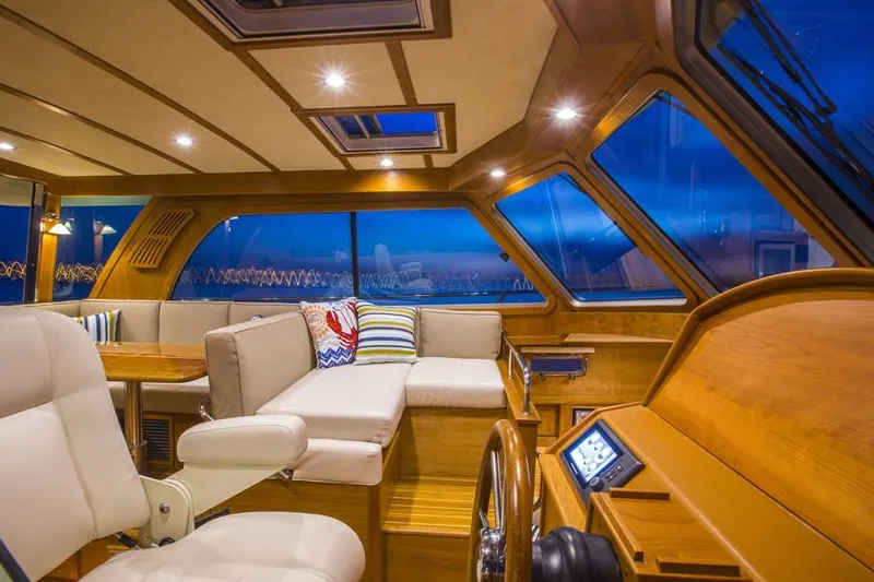 Slide: The Image of Manufacturer Provided Image: Luxurious cabin interior of 2026 Sabre 38 Salon Express yacht with cozy bedding. - 7
