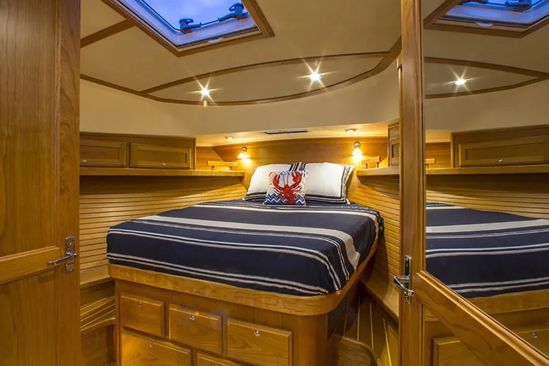 Slide: The Image of Manufacturer Provided Image: Luxurious bathroom interior of 2026 Sabre 38 Salon Express yacht with glass sink and wooden accents. - 9