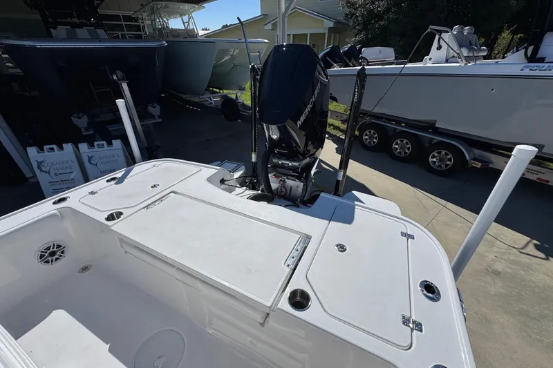 Slide: The Image of 2026 Caymas 26 HB boat with Mercury engine, docked at marina. - 32