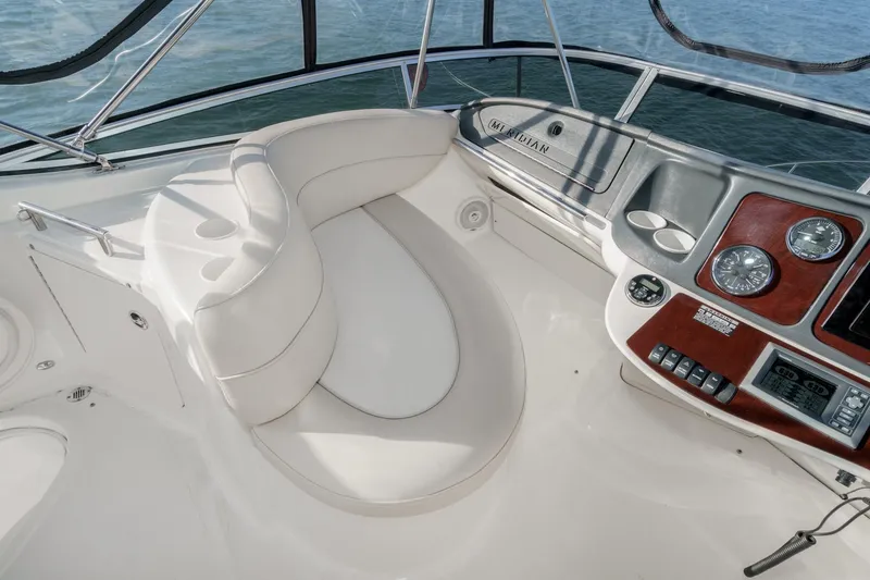 Slide: The Image of 2011 Meridian 341 Sedan cockpit with white seating and control panel. - 12