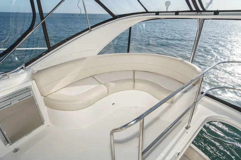 Slide: The Image of Luxurious seating area on 2011 Meridian 341 Sedan yacht overlooking the ocean. - 14