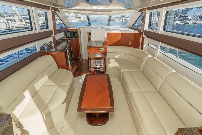 Slide: The Image of Luxurious interior of 2011 Meridian 341 Sedan yacht with leather seating and wood accents. - 18