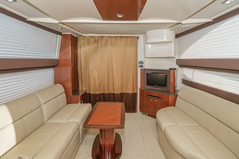Slide: The Image of Luxurious interior of 2011 Meridian 341 Sedan yacht with beige sofas and wooden accents. - 20