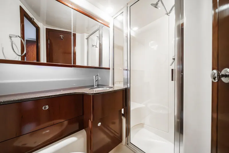 Slide: The Image of Luxurious bathroom in 2011 Meridian 341 Sedan yacht with modern fixtures and shower. - 34