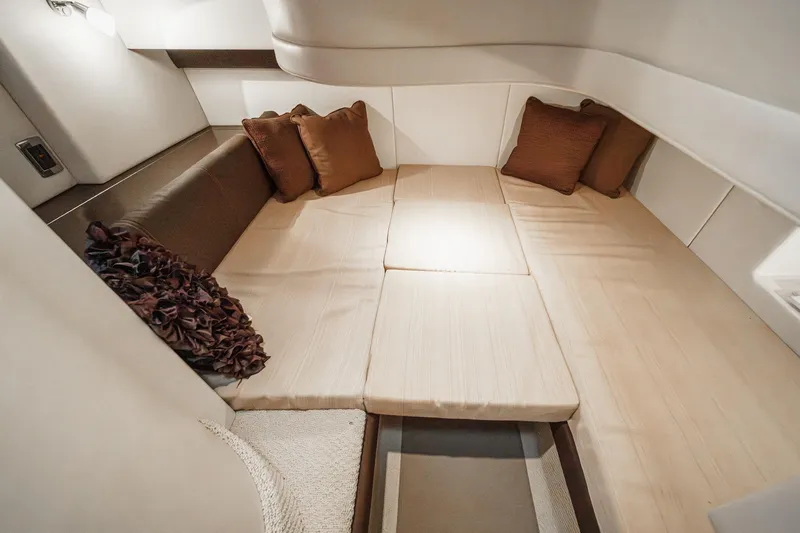 Slide: The Image of Luxurious interior cabin of 2011 Meridian 341 Sedan yacht with cozy bedding and cushions. - 38