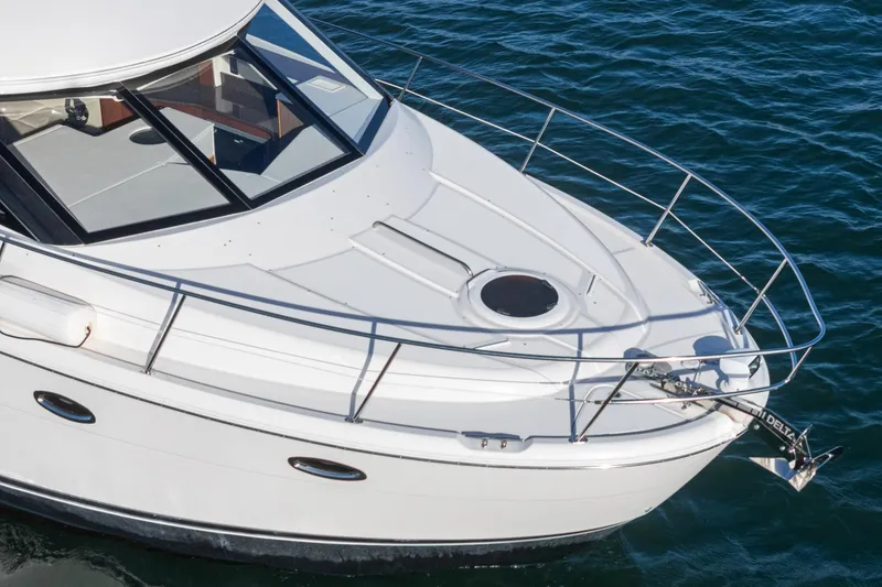 Slide: The Image of 2011 Meridian 341 Sedan yacht on water, showcasing sleek design and spacious deck. - 4