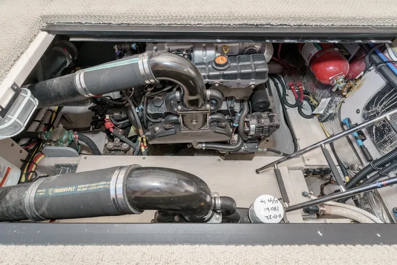 Slide: The Image of Engine compartment of a 2011 Meridian 341 Sedan boat, showcasing mechanical components. - 40