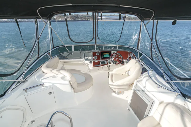 Slide: The Image of 2011 Meridian 341 Sedan yacht helm with panoramic water views. - 5