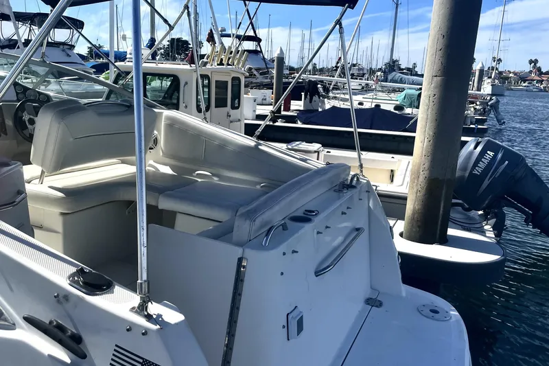 Slide: The Image of 2010 Bayliner 255 Cruiser docked at marina with Yamaha outboard motor. - 3