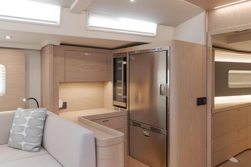 Slide: The Image of Luxurious interior of 2023 Beneteau Oceanis Yacht 60, featuring modern kitchen and seating area. - 34