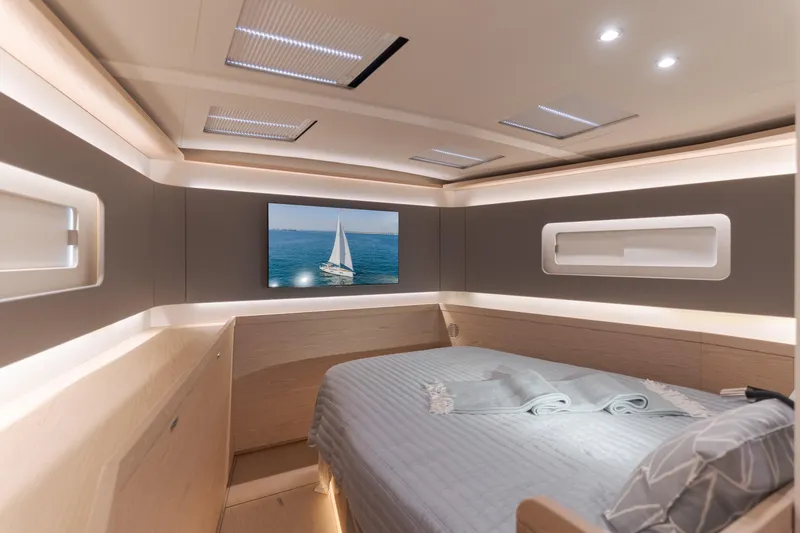 Slide: The Image of Luxurious interior of 2023 Beneteau Oceanis Yacht 60 cabin with modern design and ambient lighting. - 36