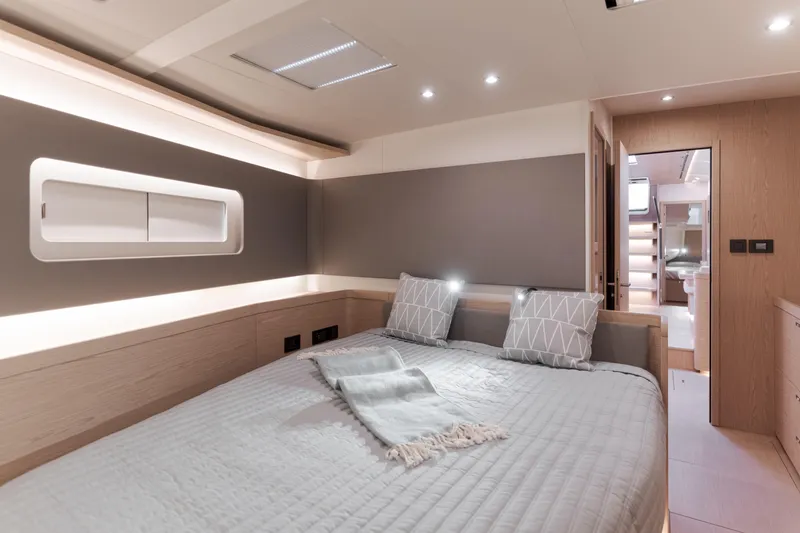 Slide: The Image of Luxurious bedroom interior of 2023 Beneteau Oceanis Yacht 60, featuring modern design and cozy ambiance. - 37