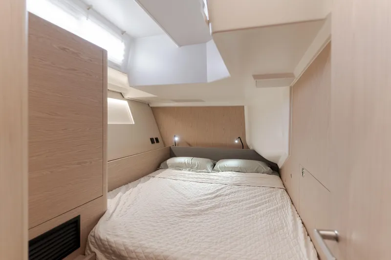 Slide: The Image of Luxurious cabin interior of 2023 Beneteau Oceanis Yacht 60 with modern design and cozy bedding. - 41
