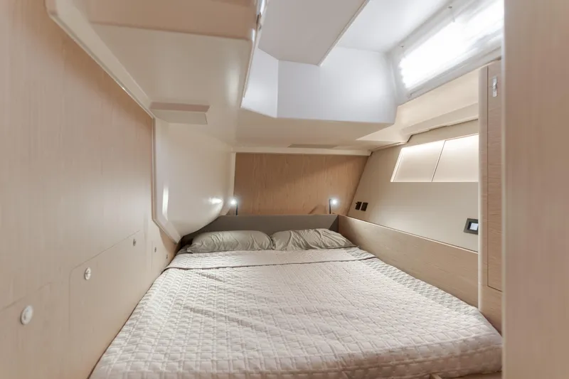Slide: The Image of Luxurious cabin interior of 2023 Beneteau Oceanis Yacht 60 with cozy bedding. - 42
