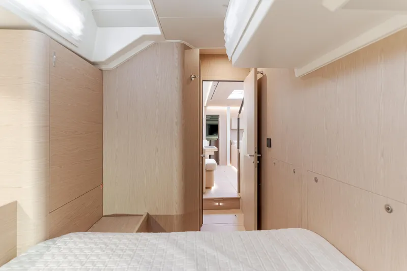 Slide: The Image of Luxurious interior of 2023 Beneteau Oceanis Yacht 60, featuring modern wood finishes and elegant design. - 43