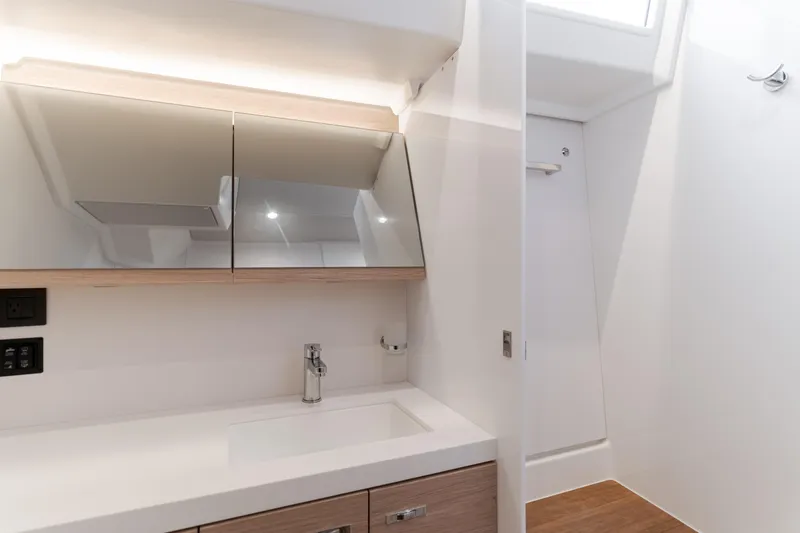 Slide: The Image of Modern bathroom interior of 2023 Beneteau Oceanis Yacht 60, featuring sleek design and fixtures. - 44