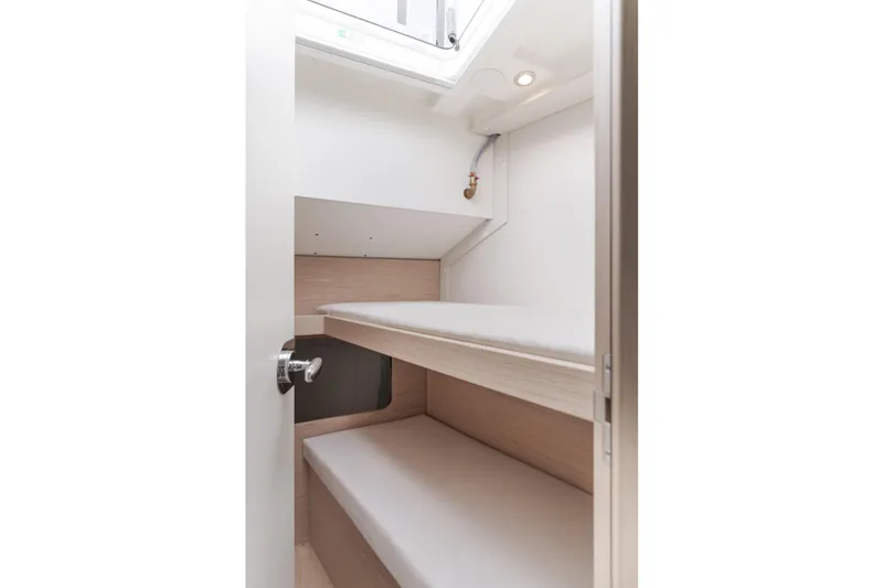 Slide: The Image of 2023 Beneteau Oceanis Yacht 60 cabin interior with bunk beds and modern design. - 45