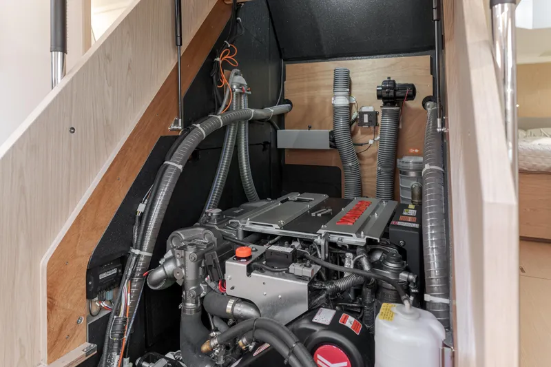 Slide: The Image of Engine room of 2023 Beneteau Oceanis Yacht 60, showcasing modern mechanical components. - 49