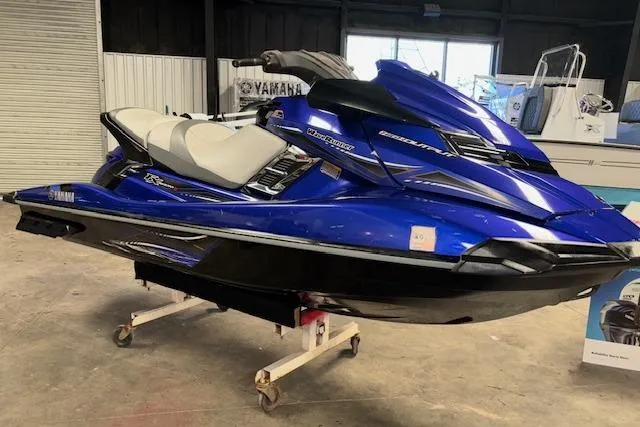 The Image of 2014 Yamaha WaveRunner FX Cruiser HO in a showroom, blue and black design. - 1