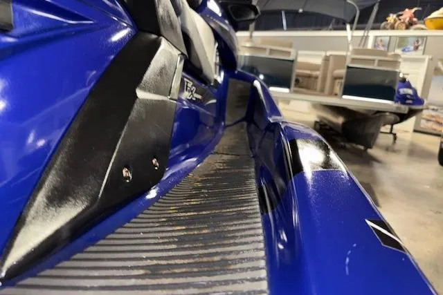 Slide: The Image of 2014 Yamaha WaveRunner FX Cruiser HO, blue and black, close-up in a showroom. - 10