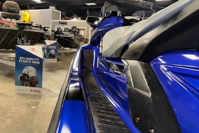 Slide: The Image of 2014 Yamaha WaveRunner FX Cruiser HO in showroom, showcasing sleek blue design. - 11