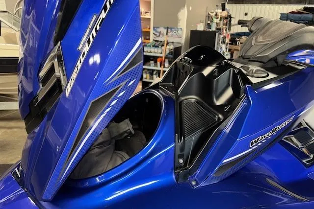 Slide: The Image of 2014 Yamaha WaveRunner FX Cruiser HO in blue, showcasing storage compartment. - 17