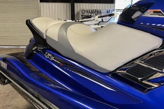 Slide: The Image of 2014 Yamaha WaveRunner FX Cruiser HO, blue and white seat detail in showroom. - 19