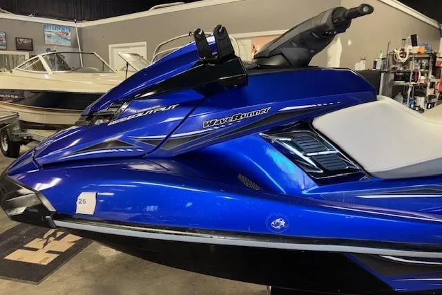 Slide: The Image of 2014 Yamaha WaveRunner FX Cruiser HO in a showroom, blue color, side view. - 5