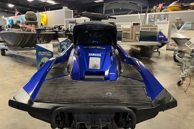 Slide: The Image of 2014 Yamaha WaveRunner FX Cruiser HO in showroom, rear view, blue color. - 8